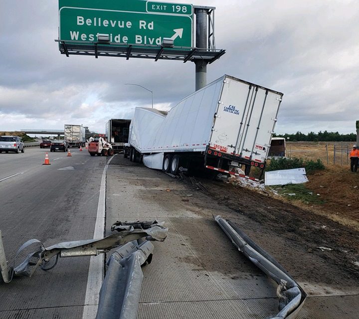 Semi-truck carrying apple juice crashes into pole
