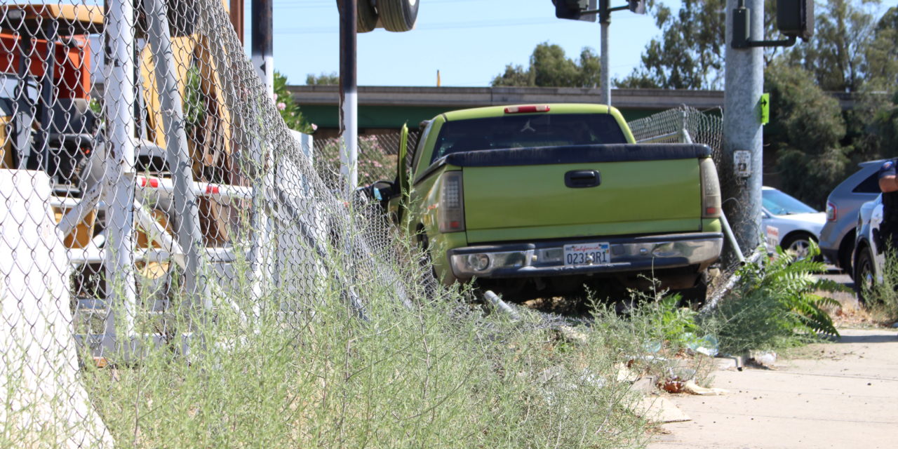 Truck crashes into fence in Atwater
