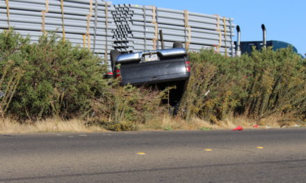 Driver survives after pickup overturns in Merced County