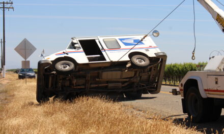 USPS mail truck overturns in Merced County