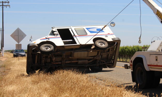 USPS mail truck overturns in Merced County