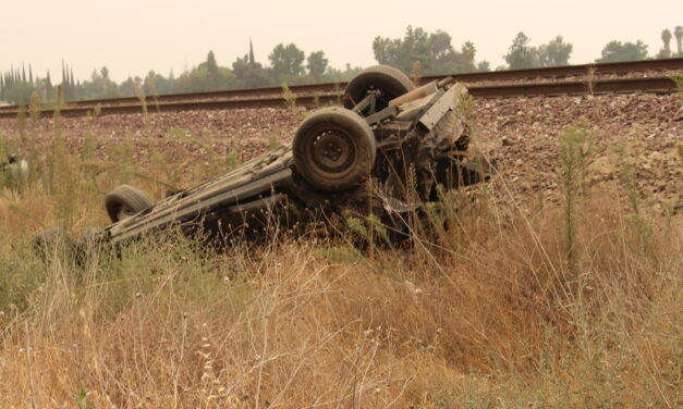 Driver attempts to pass another vehicle on Santa Fe, vehicle ends up on roof