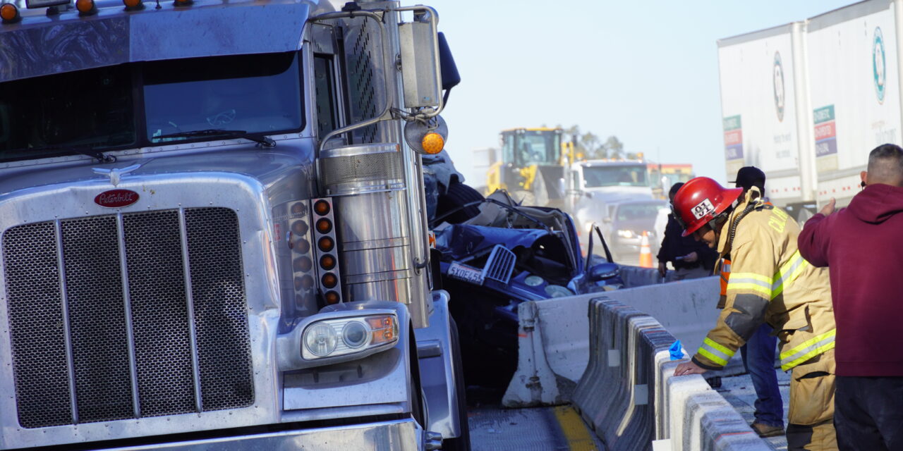 Vehicle pinned between two big rigs in Atwater, man airlifted