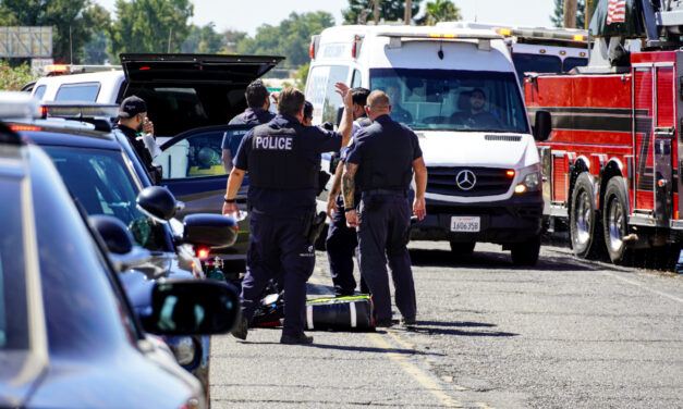 Smoke from fire leaves police officer being transported to hospital